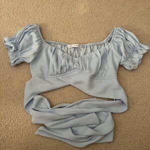 Light Blue Cropped Going-Out Top. Bow in the back. Size small.